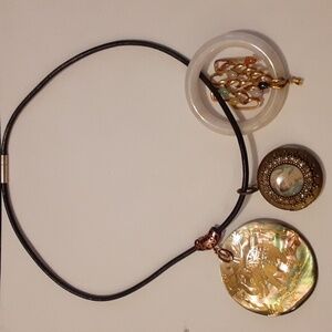 Necklace with three attachments.